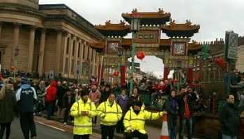 Chinese Arch and crowd during Chinese New Year celebrations 2011, Liverpool, England